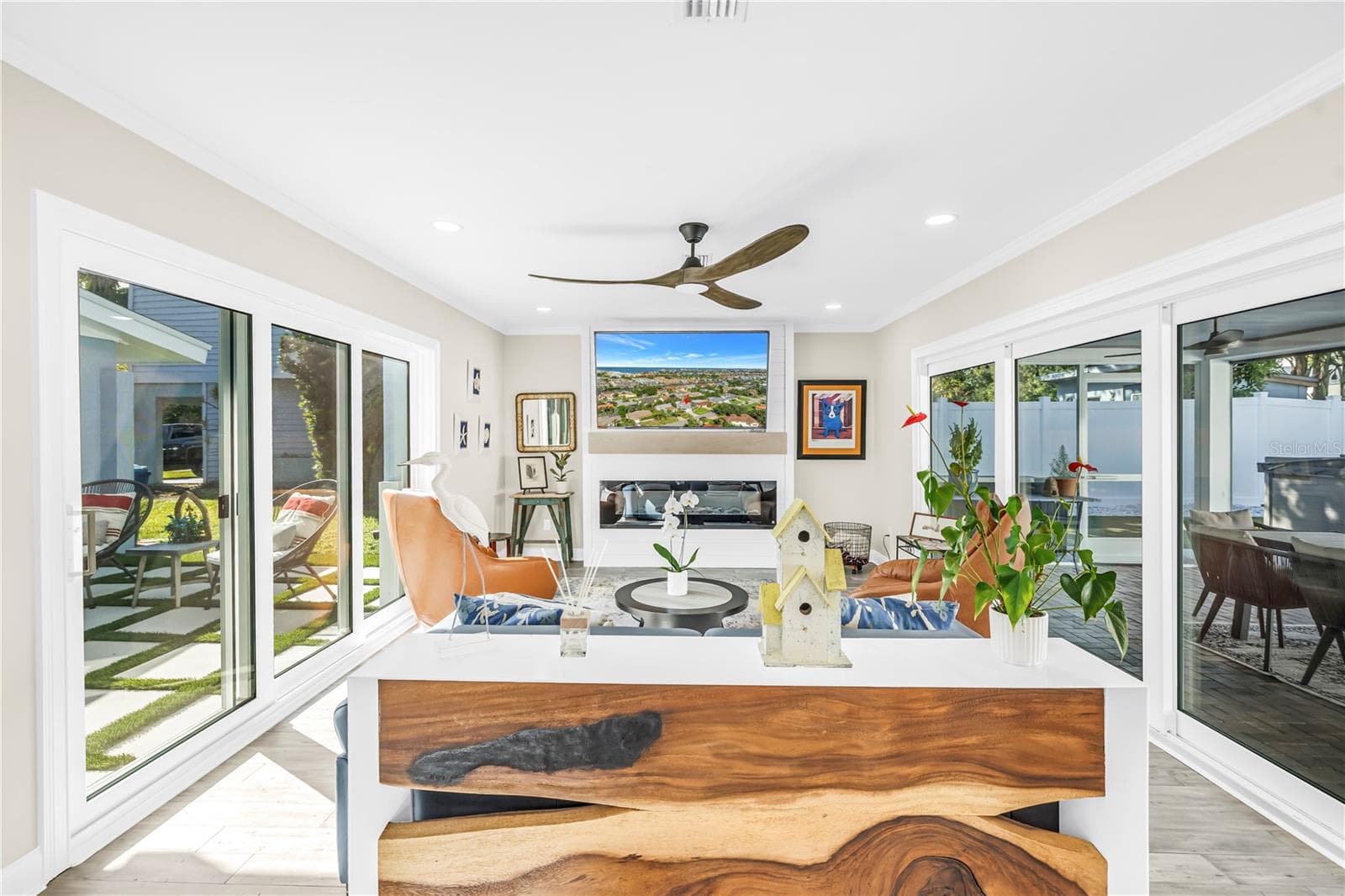 Dramatic walls of four sliders on one side and 3 sliders on the opposite side. Now THAT'S what I call a cross breeze! - 1114 2ND AVE S, TIERRA VERDE