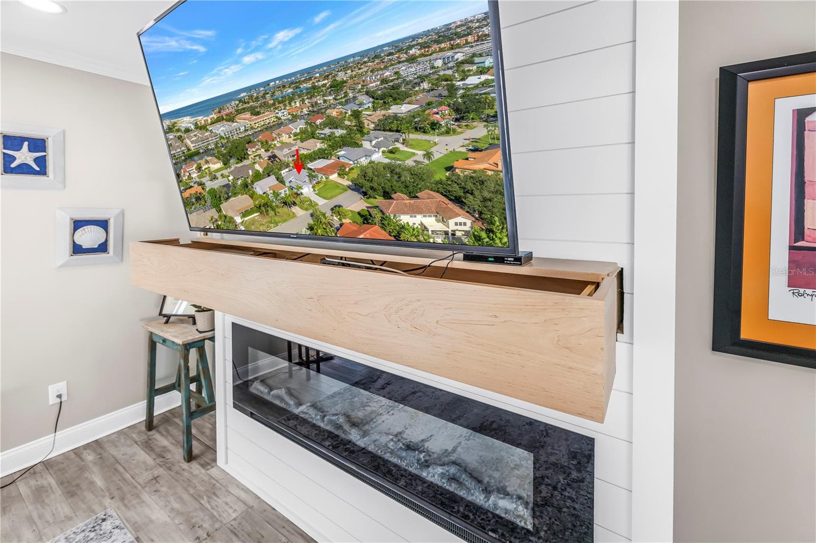 Custom mantel is an A/V storage drawer over the electric fireplace. - 1114 2ND AVE S, TIERRA VERDE