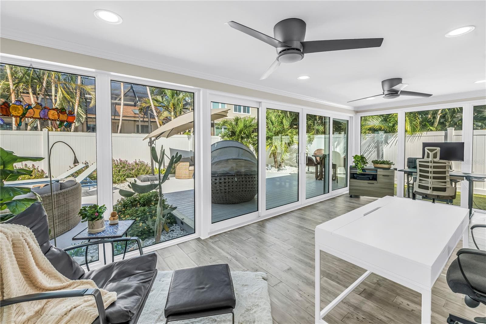 Beautiful light filled living space surrounded by impact rated double sliders. - 1114 2ND AVE S, TIERRA VERDE