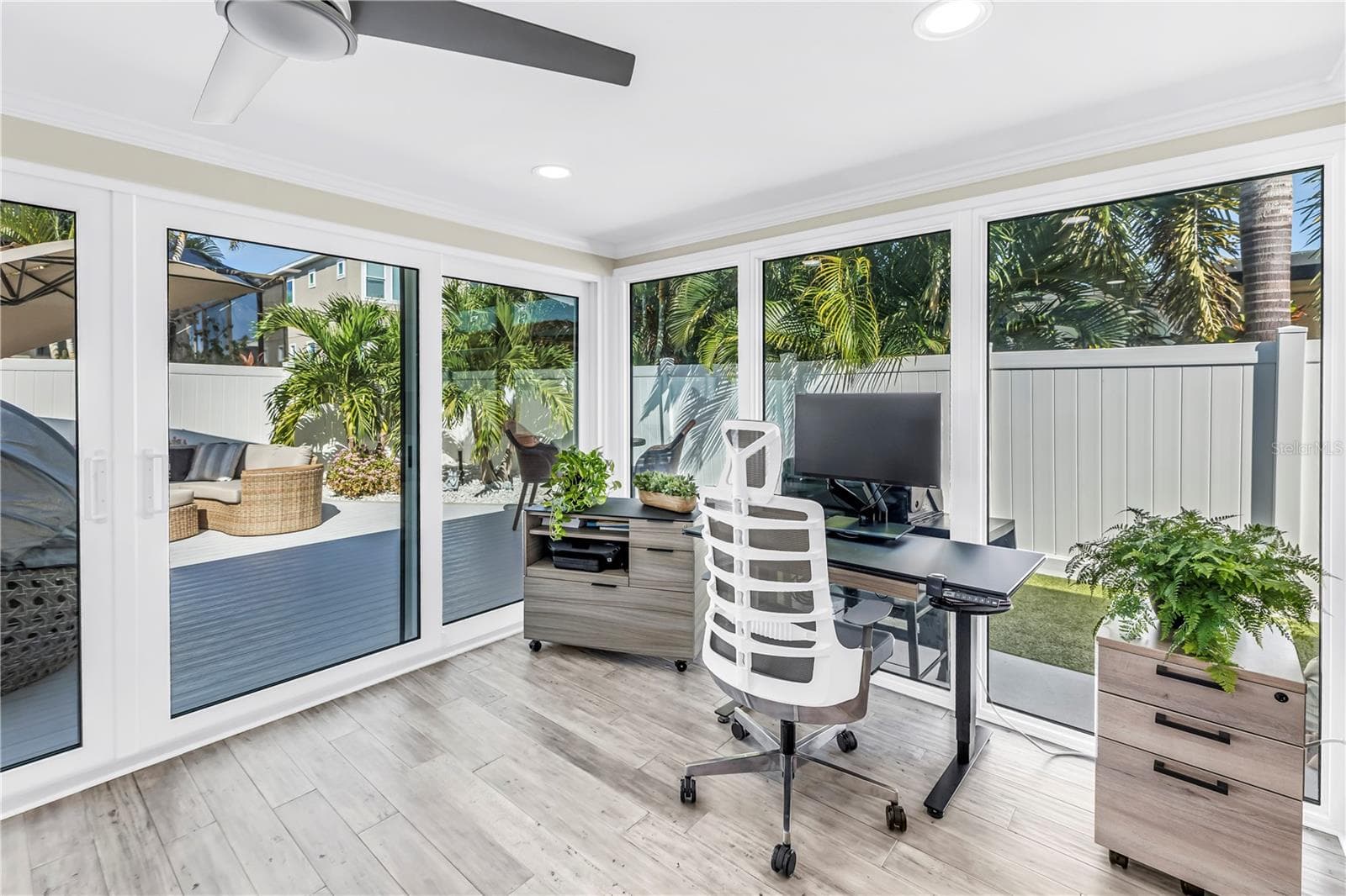Surround yourself with views of the open outdoor and pool areas. - 1114 2ND AVE S, TIERRA VERDE