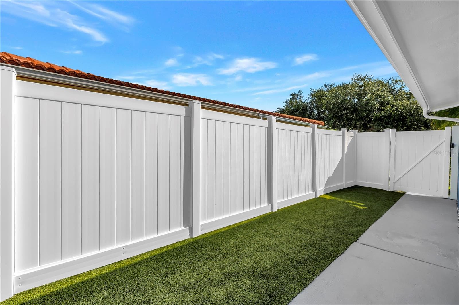 Astro turf is pet friendly and easy to hose and maintain. - 1114 2ND AVE S, TIERRA VERDE
