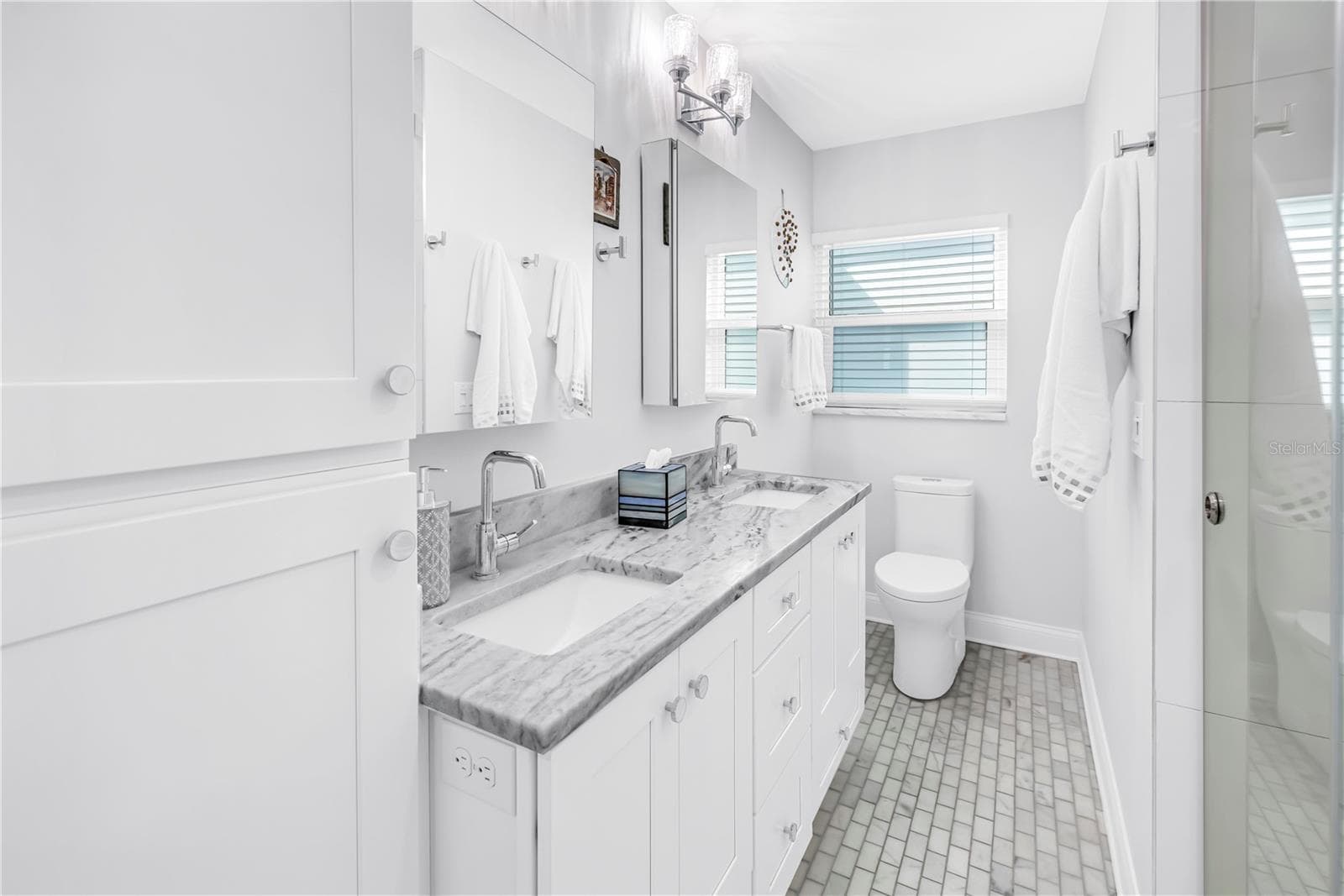 Deep vanity drawers, linen closet and 2 Robern medicine cabinets with dual interior mirrors and electrical outlets. - 1114 2ND AVE S, TIERRA VERDE
