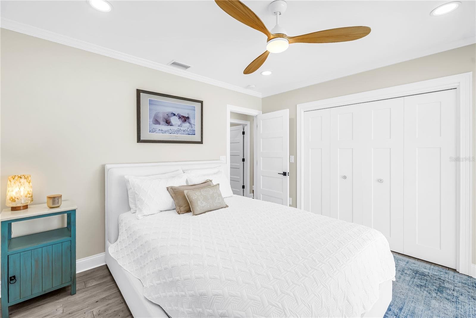 Second bedroom with custom closet built-ins. - 1114 2ND AVE S, TIERRA VERDE