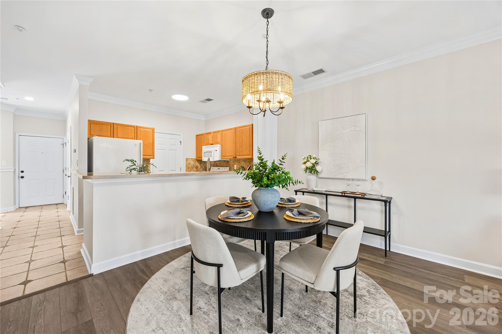 Spacious dining area with bar, plenty of room to add additional seating and bar stools. - 915 Northeast Drive, Davidson