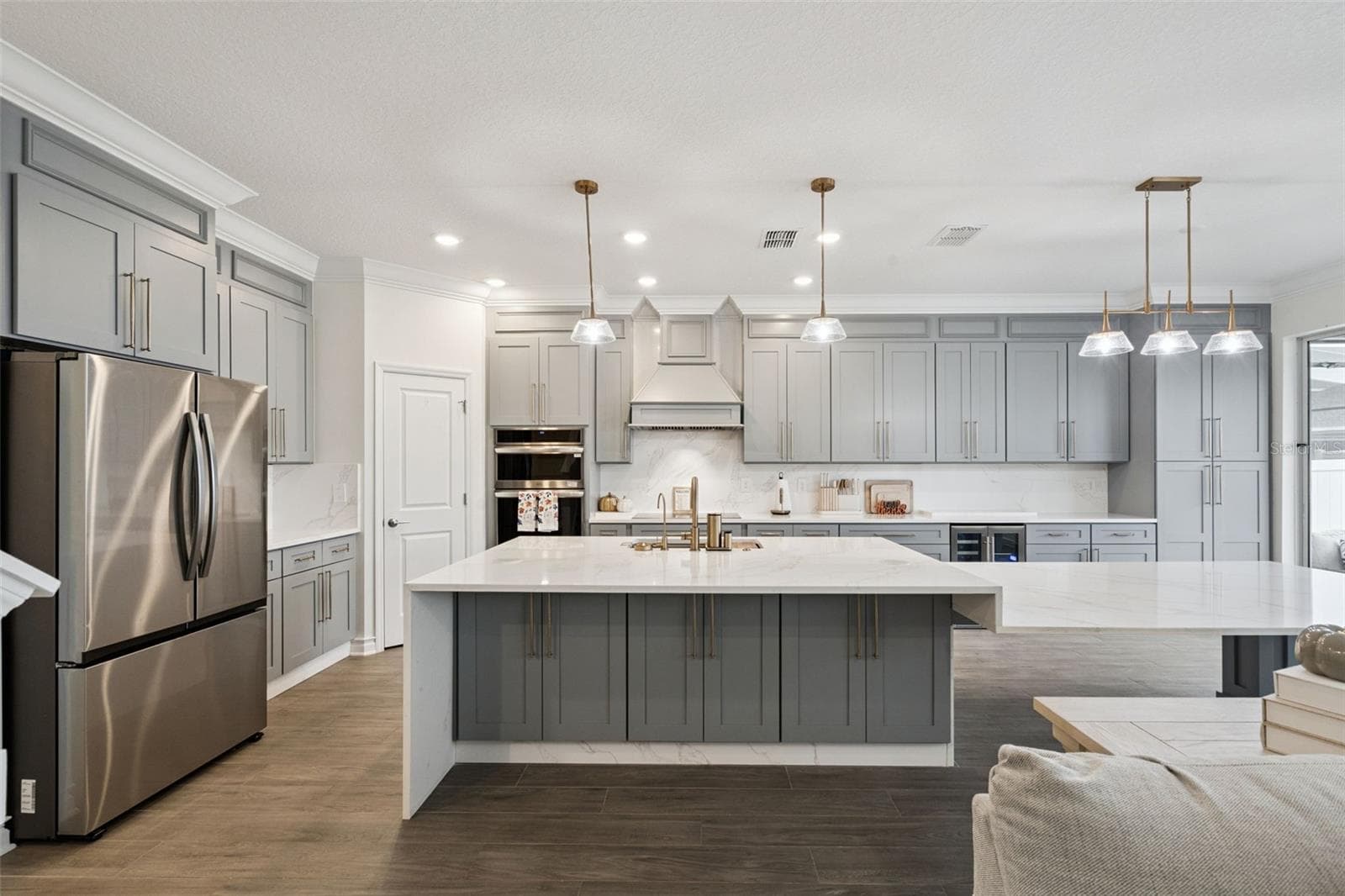 Different kitchen angles showing the abundance of custom cabinets - 6175 SHAVASANA RD RD, CLERMONT