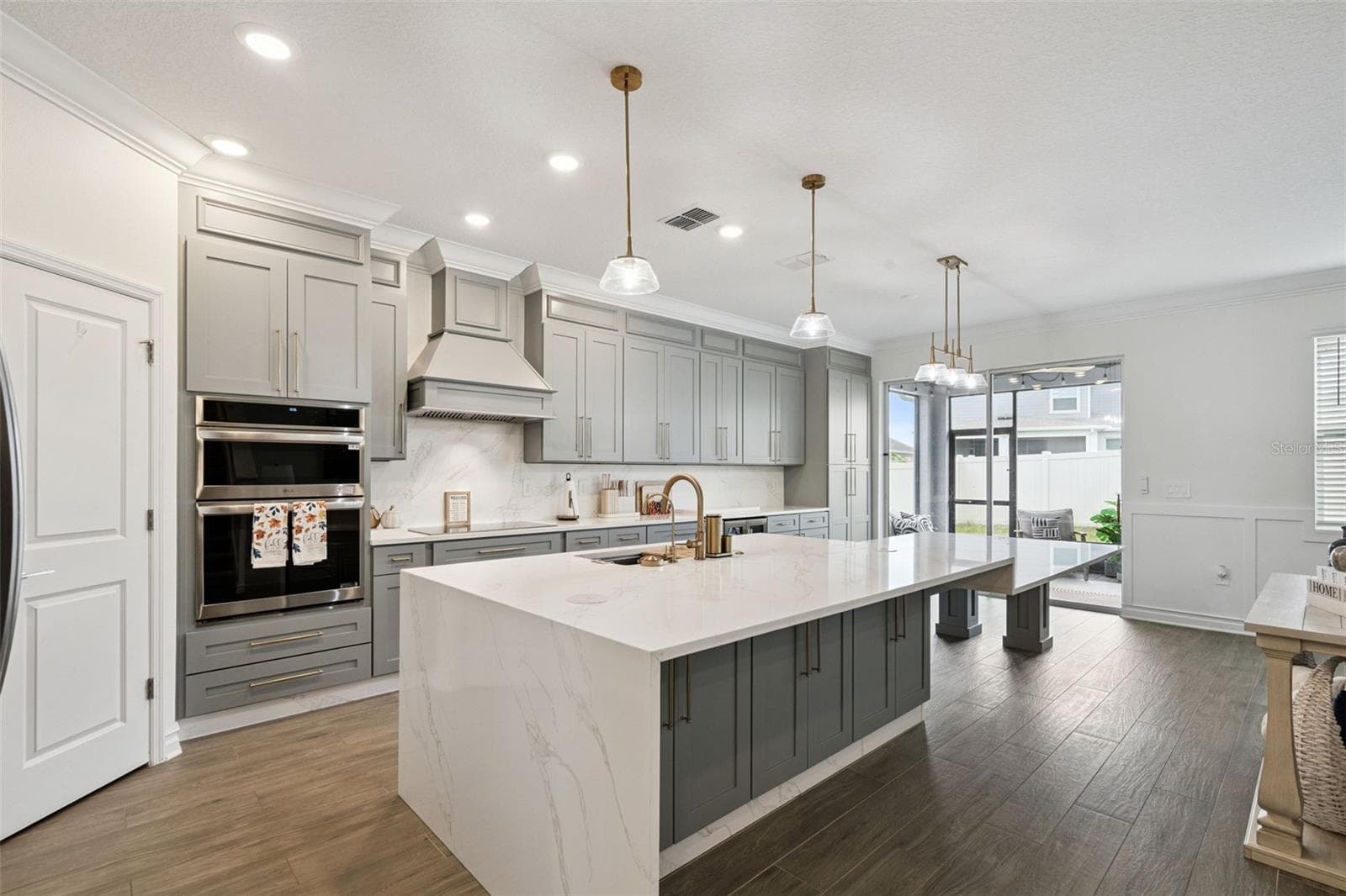 Beautiful UPGRADED wood look ceramic tile flooring throught the first floor - 6175 SHAVASANA RD RD, CLERMONT