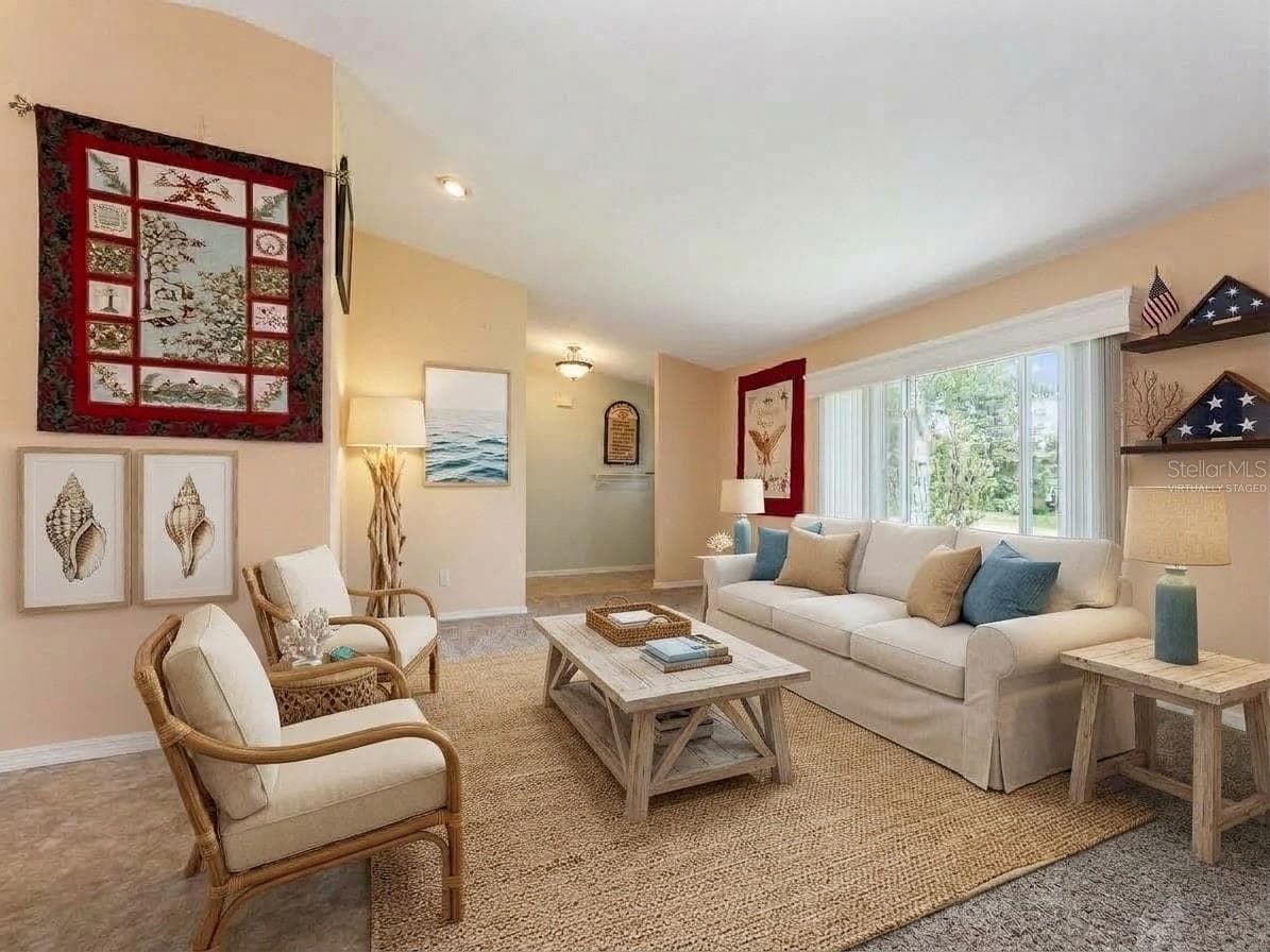 Living Room | Virtually Staged | Spacious front living room with large impact windows bringing in abundant natural light. Photo has been virtually staged. - 23088 GRAY AVE, PORT CHARLOTTE