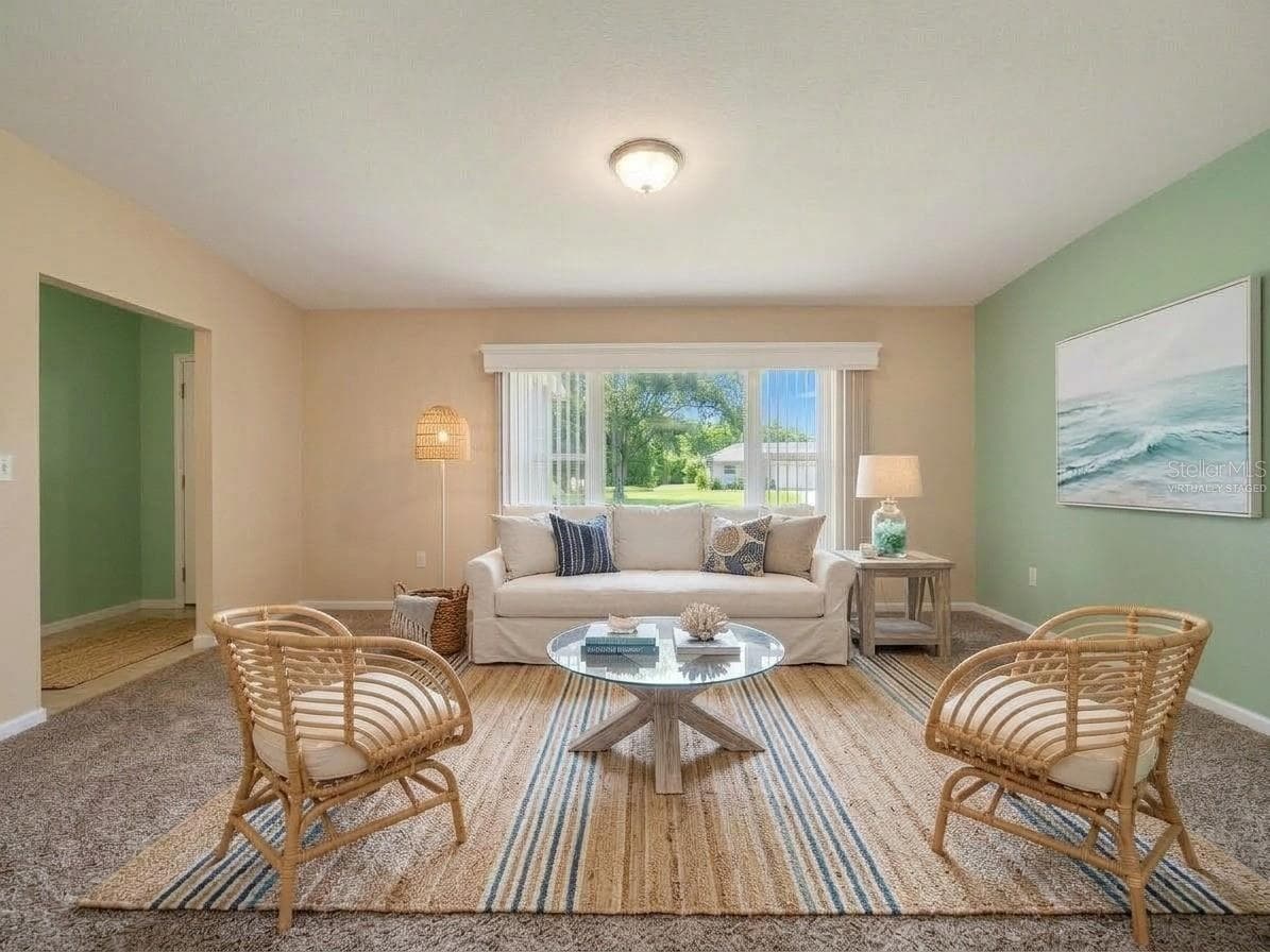 Living Room | Virtually Staged | Another view of the spacious front living room and its flexible layout. Photo has been virtually staged. - 23088 GRAY AVE, PORT CHARLOTTE
