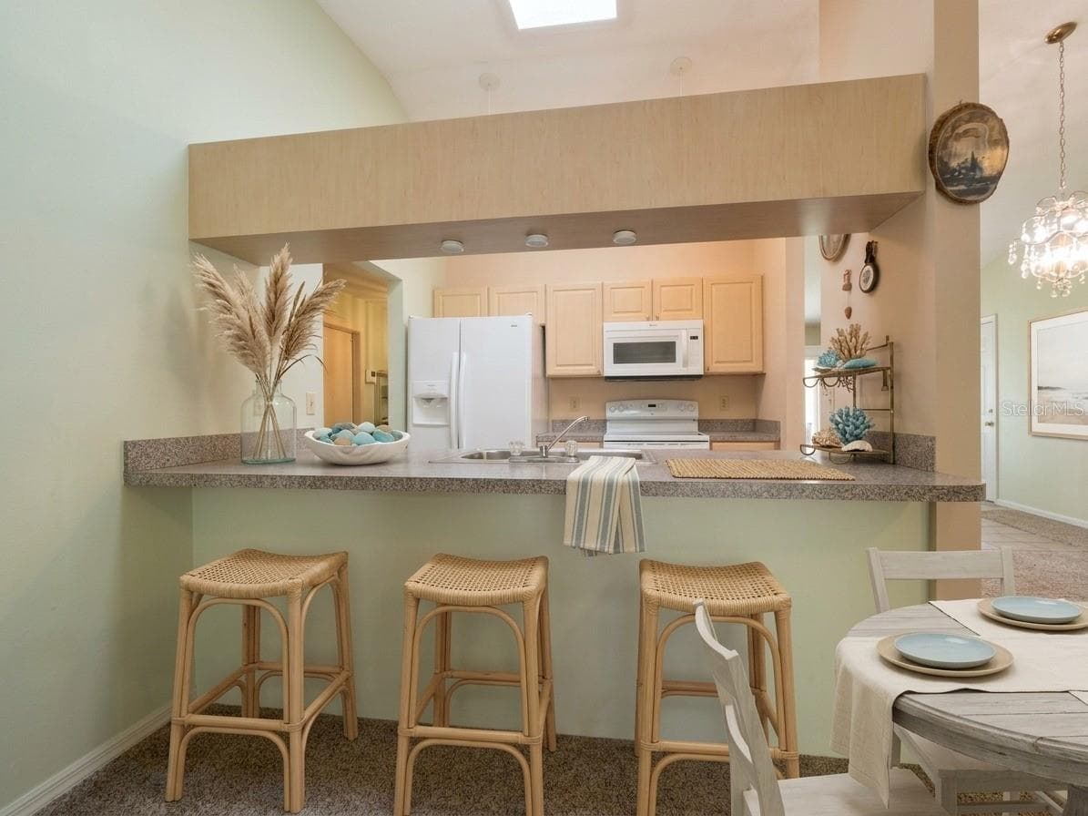 Kitchen | Large center island provides additional prep space, storage, and room for casual seating. - 23088 GRAY AVE, PORT CHARLOTTE