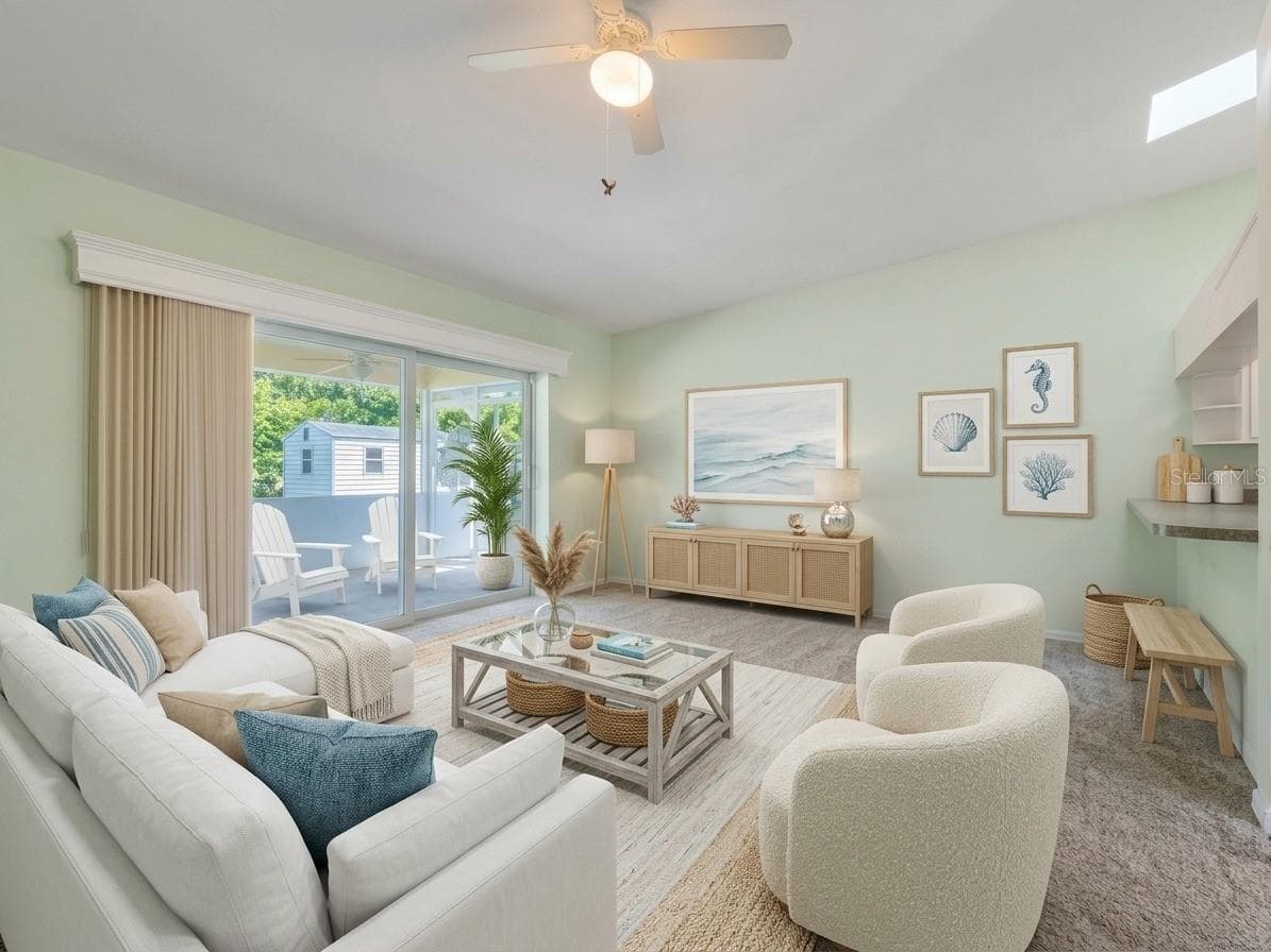 Family Room | Bright family room with large impact pocket sliders opening to the screened lanai. - 23088 GRAY AVE, PORT CHARLOTTE
