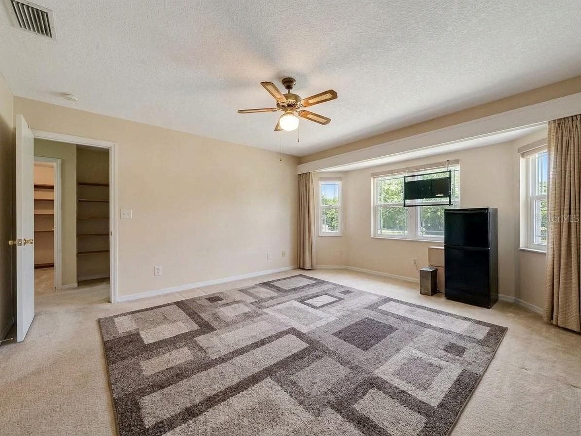 Primary Bedroom | Spacious primary bedroom privately positioned within the home's split bedroom floor plan. - 23088 GRAY AVE, PORT CHARLOTTE