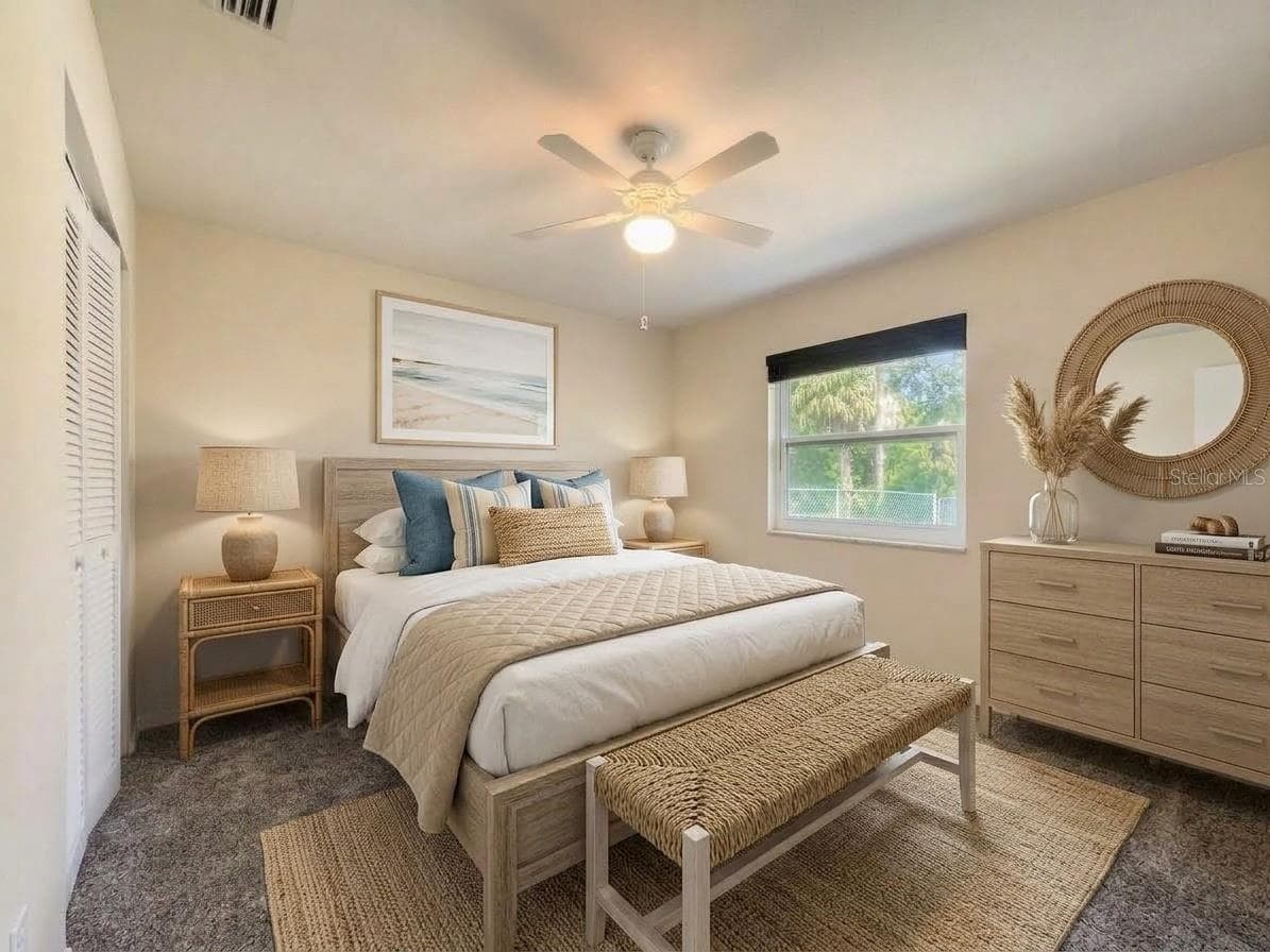 Guest Bedroom | Comfortable guest bedroom with natural light and flexible space for family, visitors, or a home office. - 23088 GRAY AVE, PORT CHARLOTTE