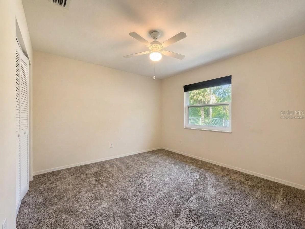 Guest Bedroom | Virtually Staged | Virtually staged to showcase the size and potential of the guest bedroom. Photo has been virtually staged. - 23088 GRAY AVE, PORT CHARLOTTE