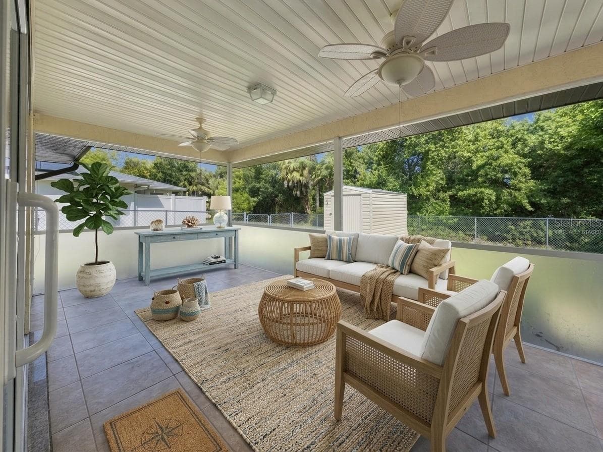 Screened Lanai | Virtually Staged | Large screened lanai overlooking the backyard and showcasing the potential for a comfortable outdoor living and dining space. Photo has been virtually staged. - 23088 GRAY AVE, PORT CHARLOTTE