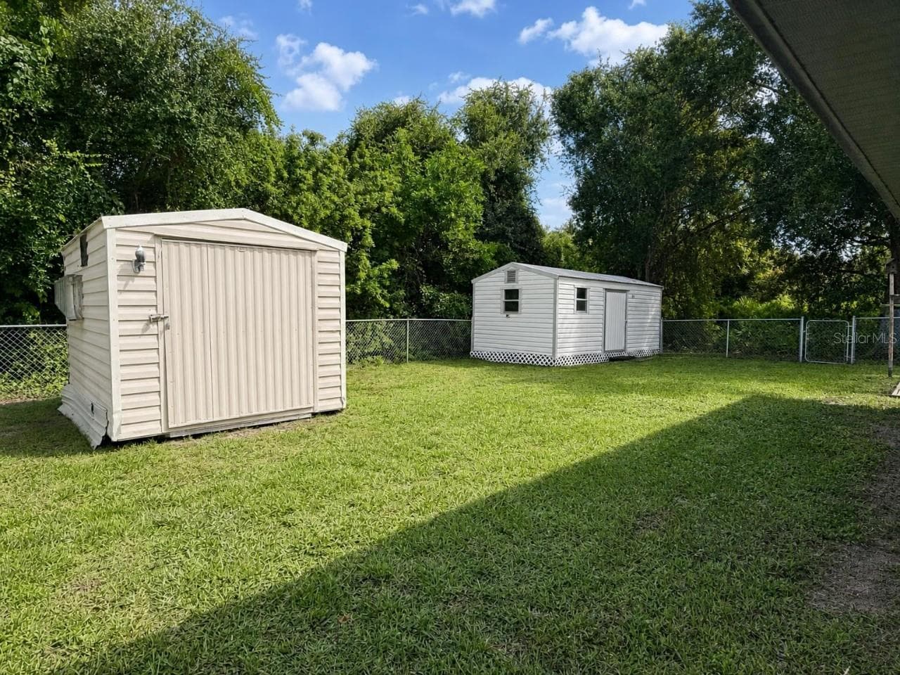 Screened Lanai | Another view of the expansive screened outdoor living area with direct access to the backyard. - 23088 GRAY AVE, PORT CHARLOTTE