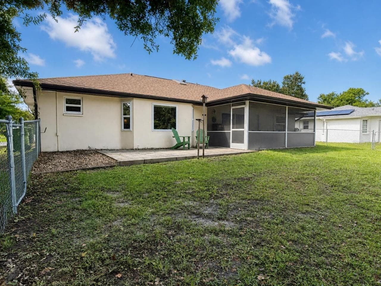 Backyard | Spacious fully fenced backyard with plenty of room for pets, play, gardening, or creating your own outdoor retreat. - 23088 GRAY AVE, PORT CHARLOTTE