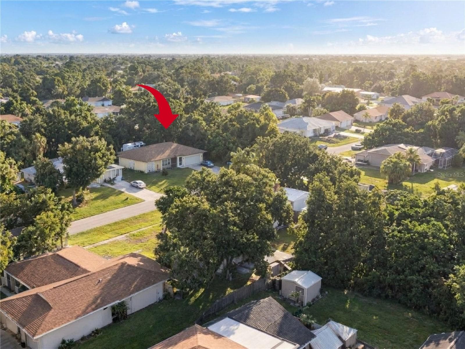 Aerial View | Aerial view showcasing the property, spacious lot, and surrounding Port Charlotte neighborhood. - 23088 GRAY AVE, PORT CHARLOTTE
