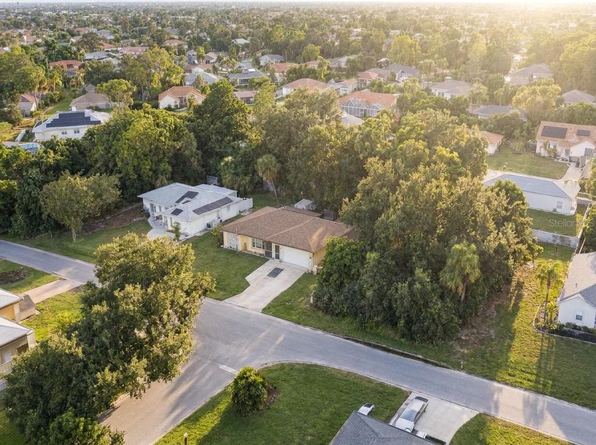 Aerial View | Elevated perspective highlighting the home's convenient location within an established residential area. - 23088 GRAY AVE, PORT CHARLOTTE
