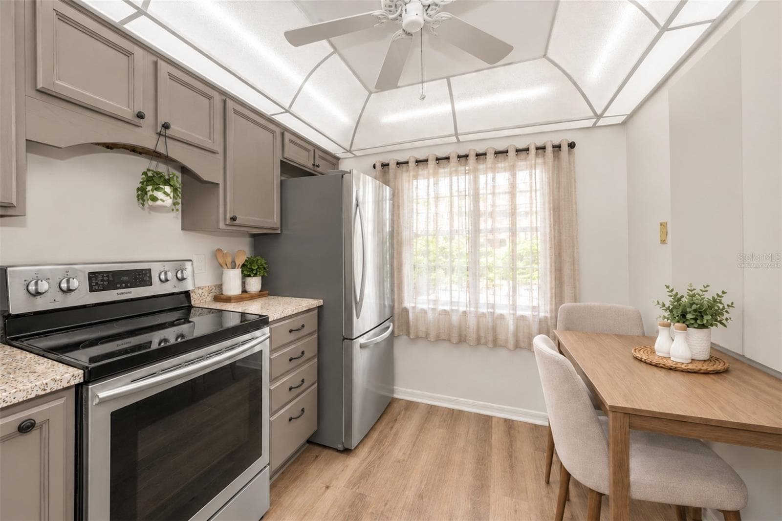 virtually staged, used the 5k and have kitchen cabinets painted - 2119 ELM ST #103, DUNEDIN