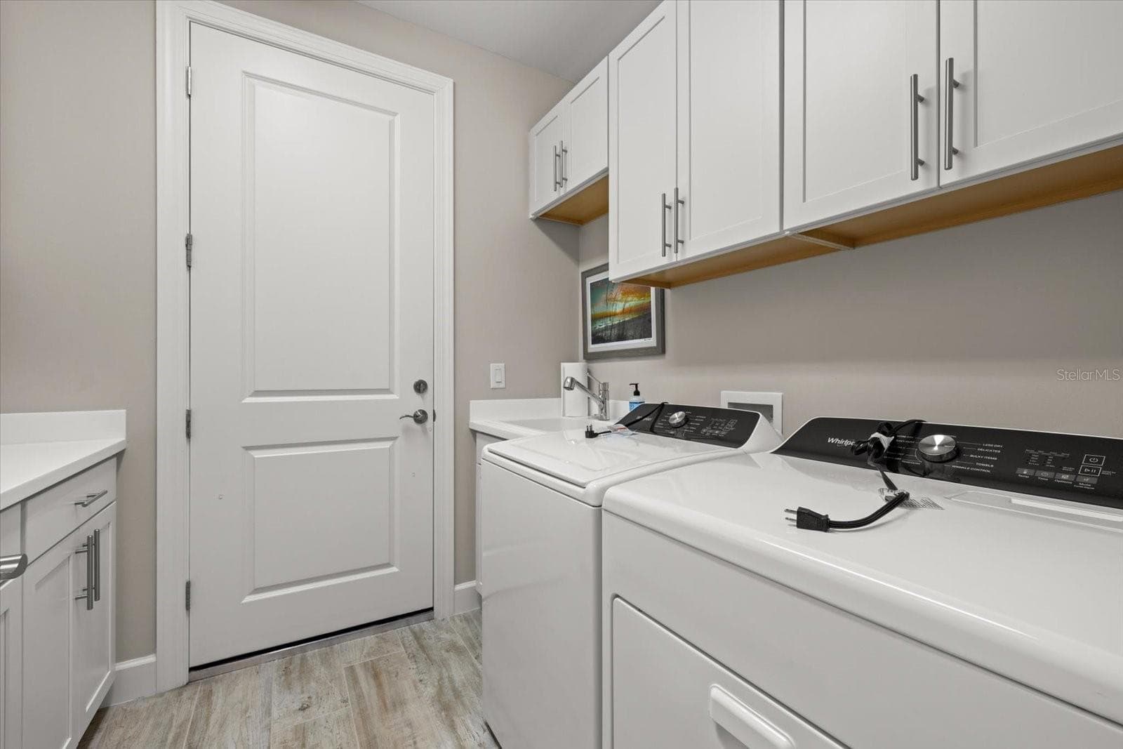 Laundry Room with Many Storage Closets - 12446 MARSH POINTE RD, SARASOTA