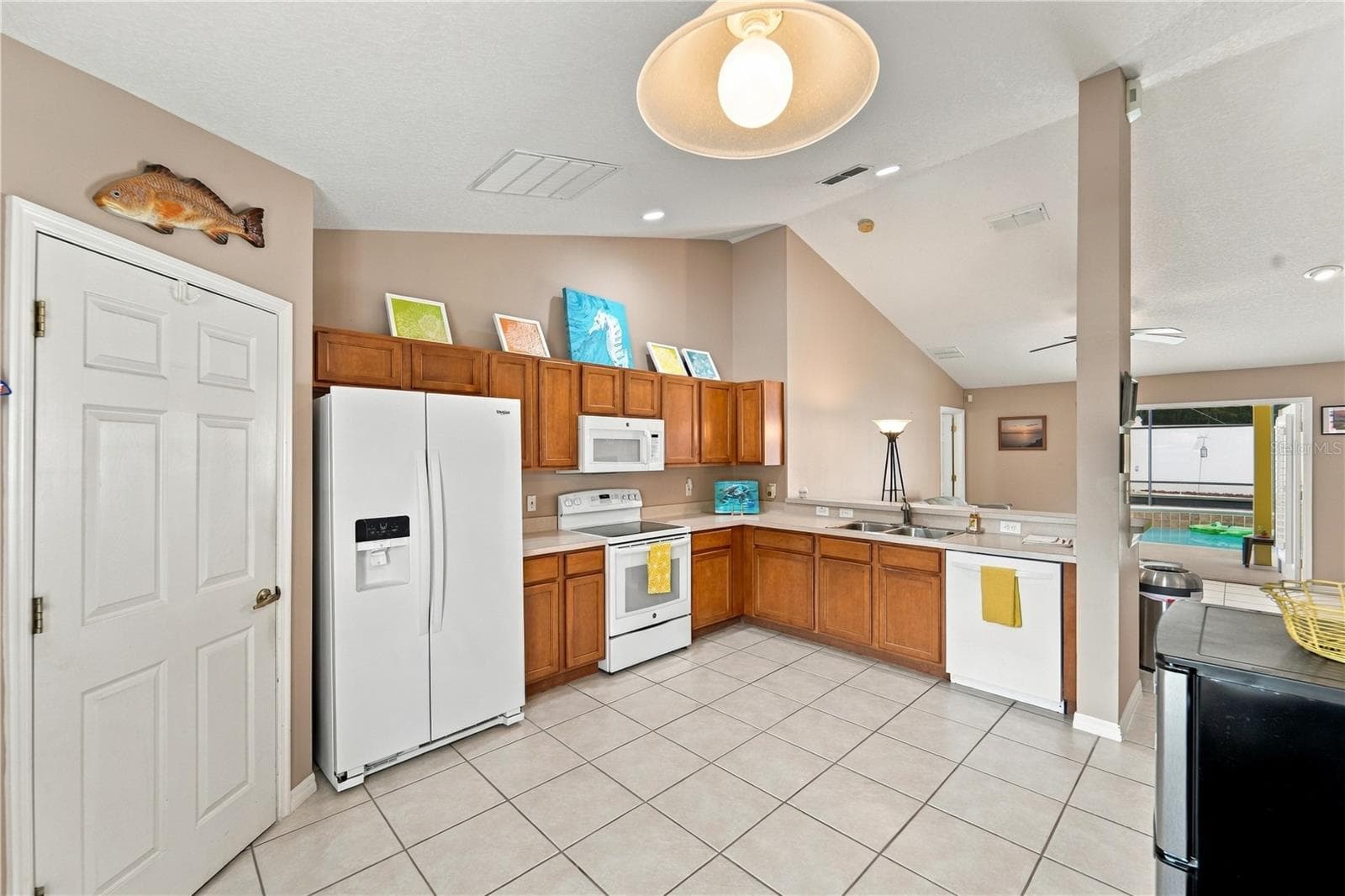 Kitchen looking towards family room and pool - 1420 BENT OAKS BLVD, DELAND