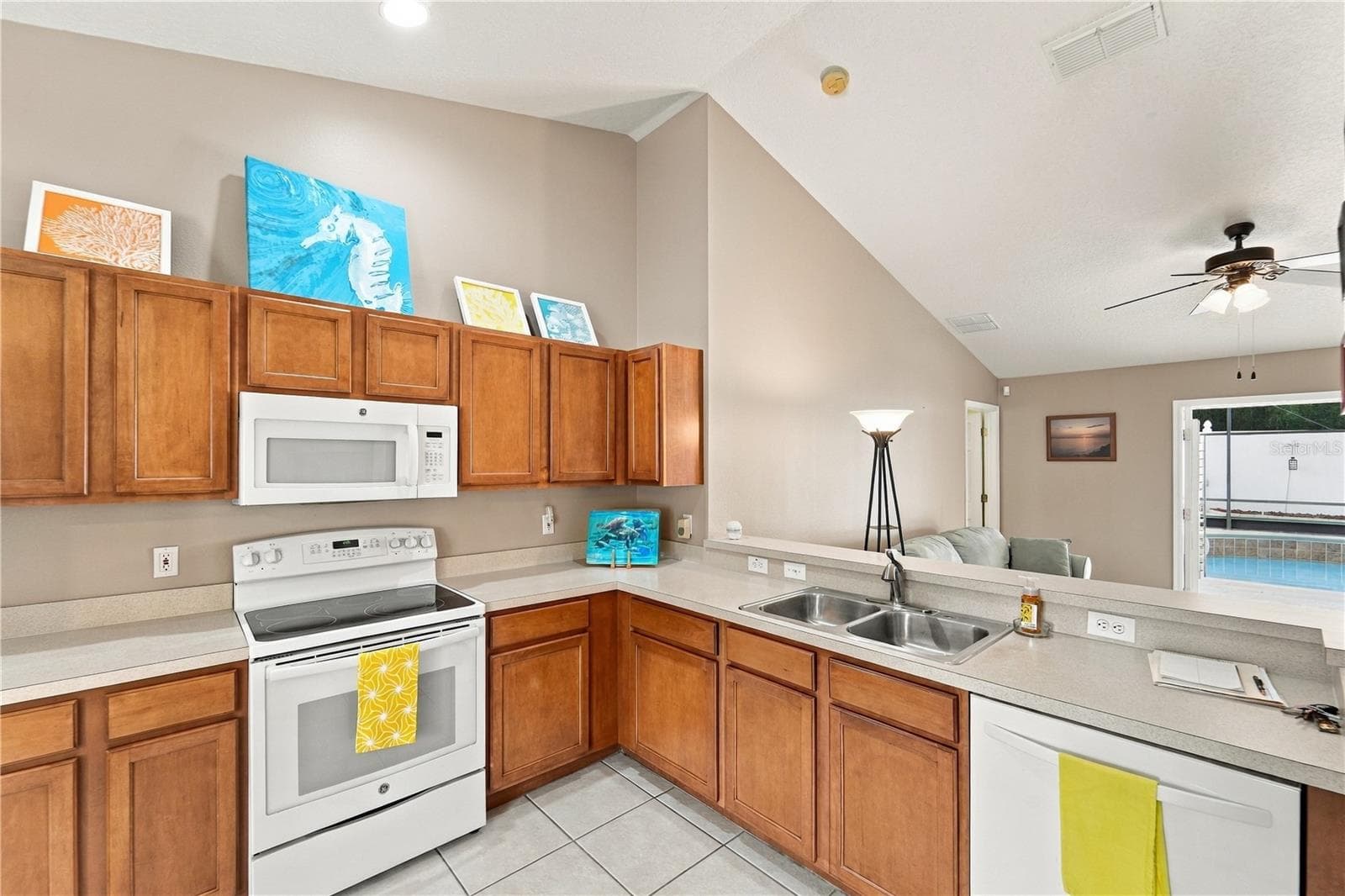 Kitchen is well designed so you can check on your guests in the pool area - 1420 BENT OAKS BLVD, DELAND