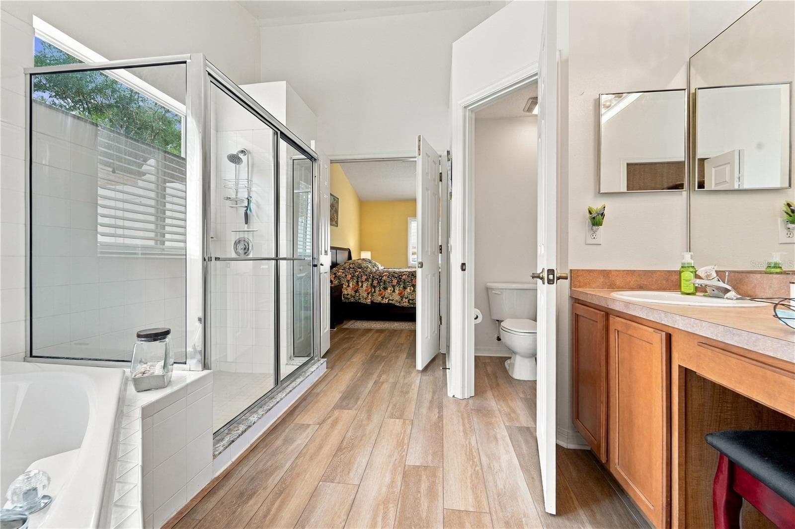 Another view of primary bathroom looking from walk-in closet - 1420 BENT OAKS BLVD, DELAND