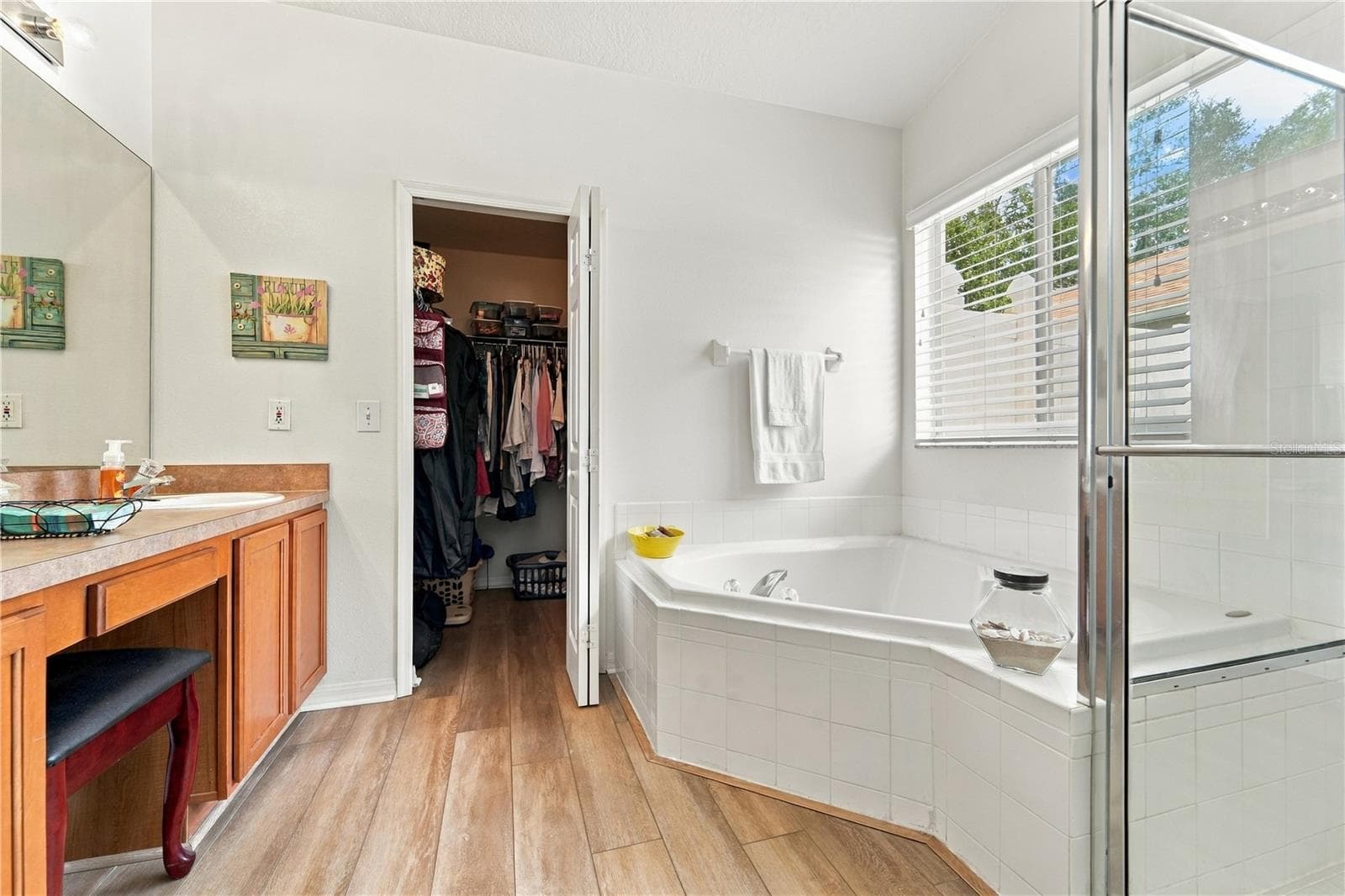 Primary bathroom with seating area and walk-in closet - 1420 BENT OAKS BLVD, DELAND