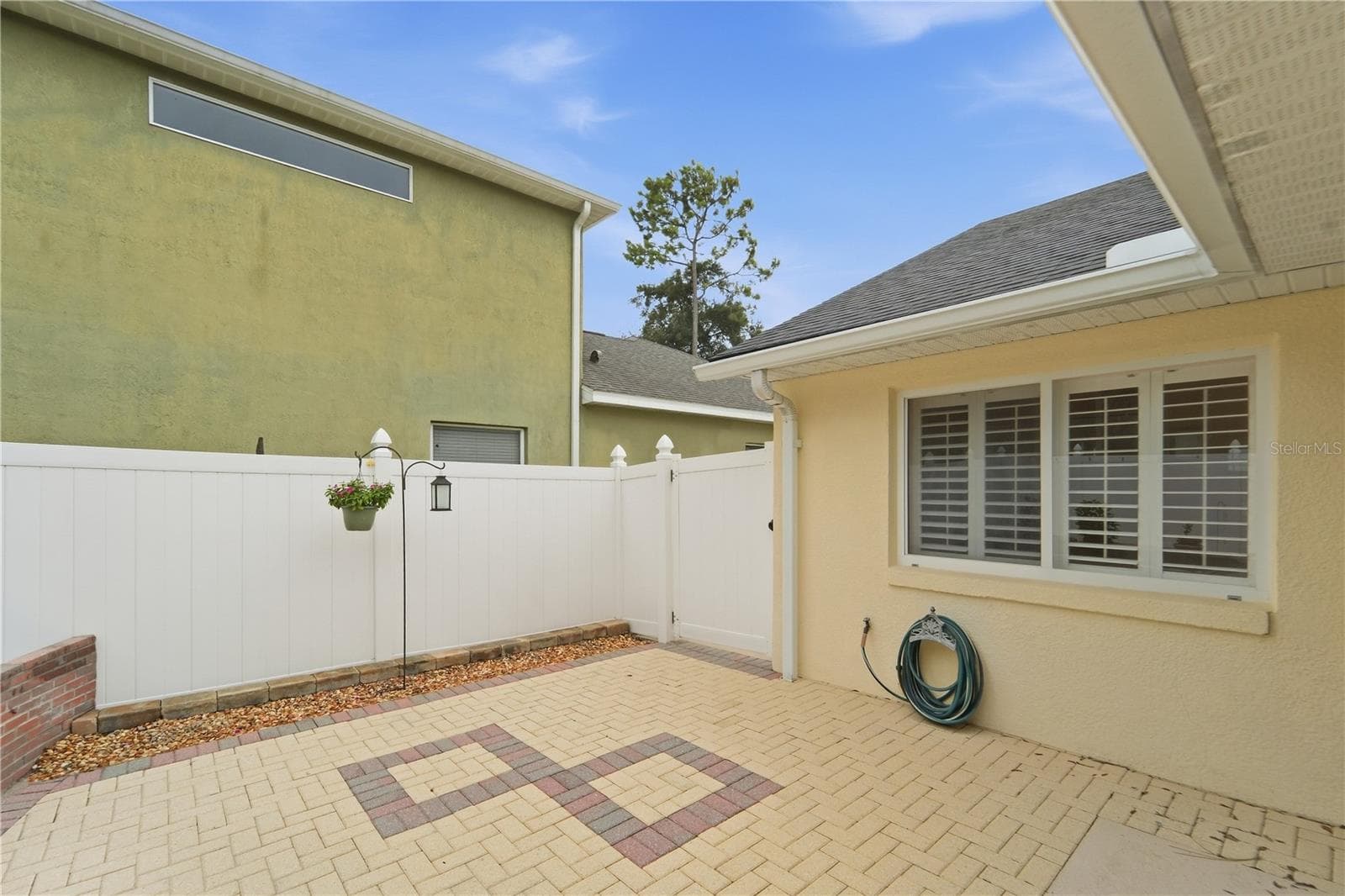Courtyard area with gate to an additional "storage" area - 1420 BENT OAKS BLVD, DELAND