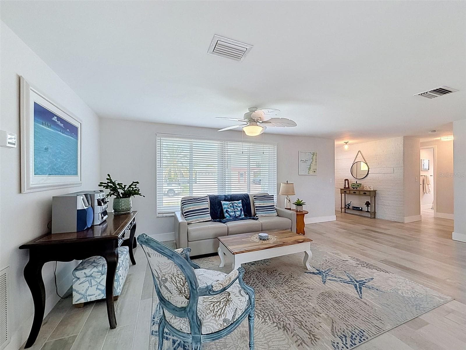 LIVING ROOM RIGHT OFF OF THE KITCHEN - 6618 LEESIDE ISLE, HUDSON