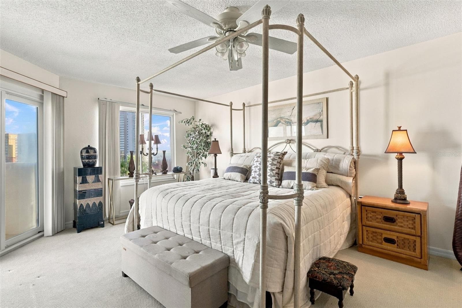 Main level primary bedroom with balcony access and ocean views - 3 OCEANS WEST BLVD #7D7, DAYTONA BEACH SHORES