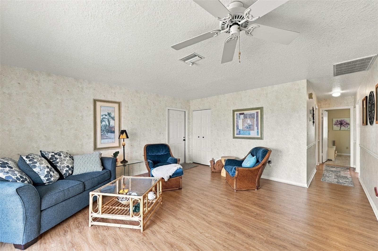 From the living room, the bedrooms and baths are just down the hall. - 215 GENET CT, SUN CITY CENTER