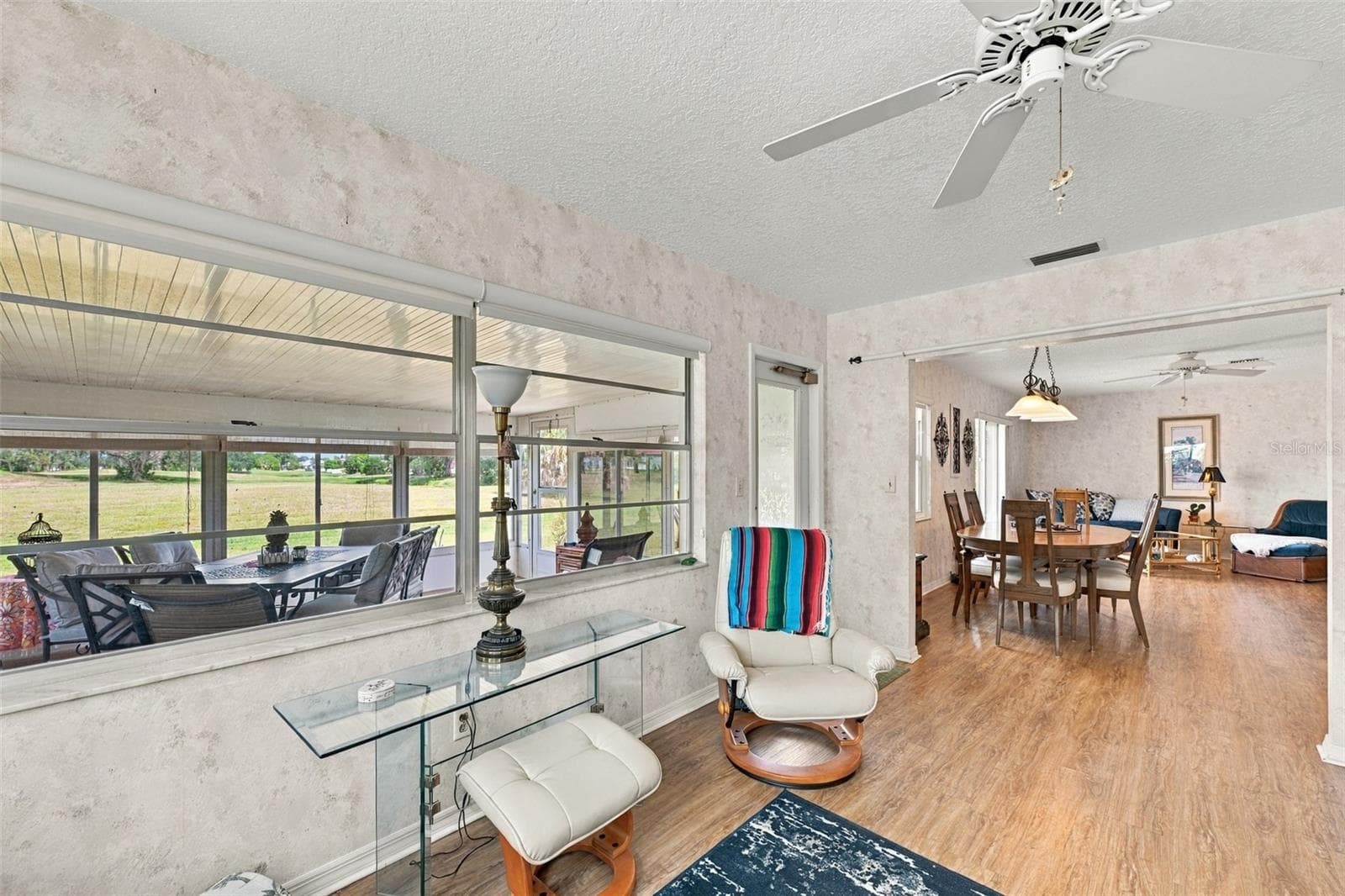 The family room is bright and spacious and opens directly onto the Florida room. - 215 GENET CT, SUN CITY CENTER
