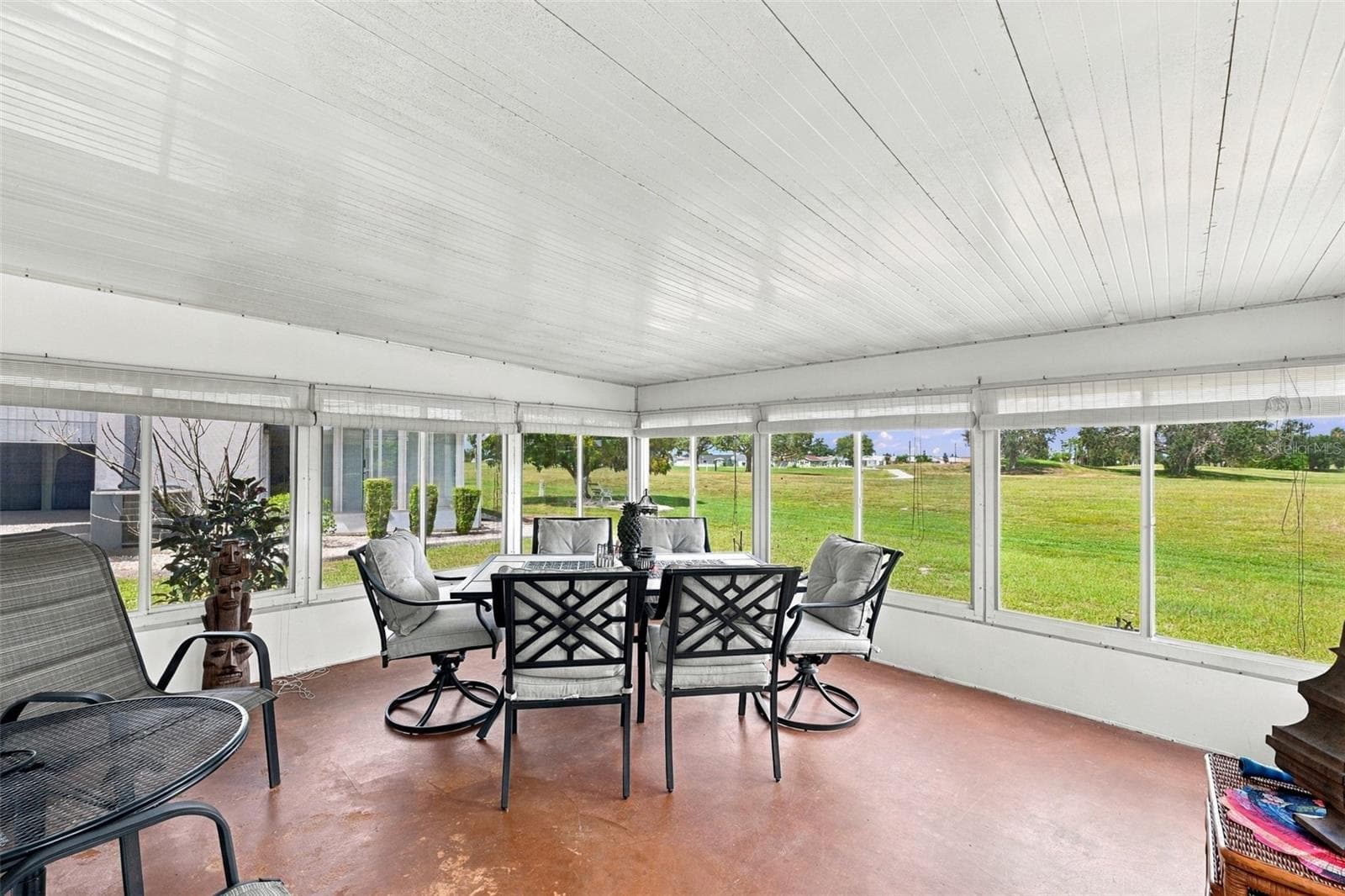 An oversized Florida room is perfect for relaxing and watching the world go by. - 215 GENET CT, SUN CITY CENTER