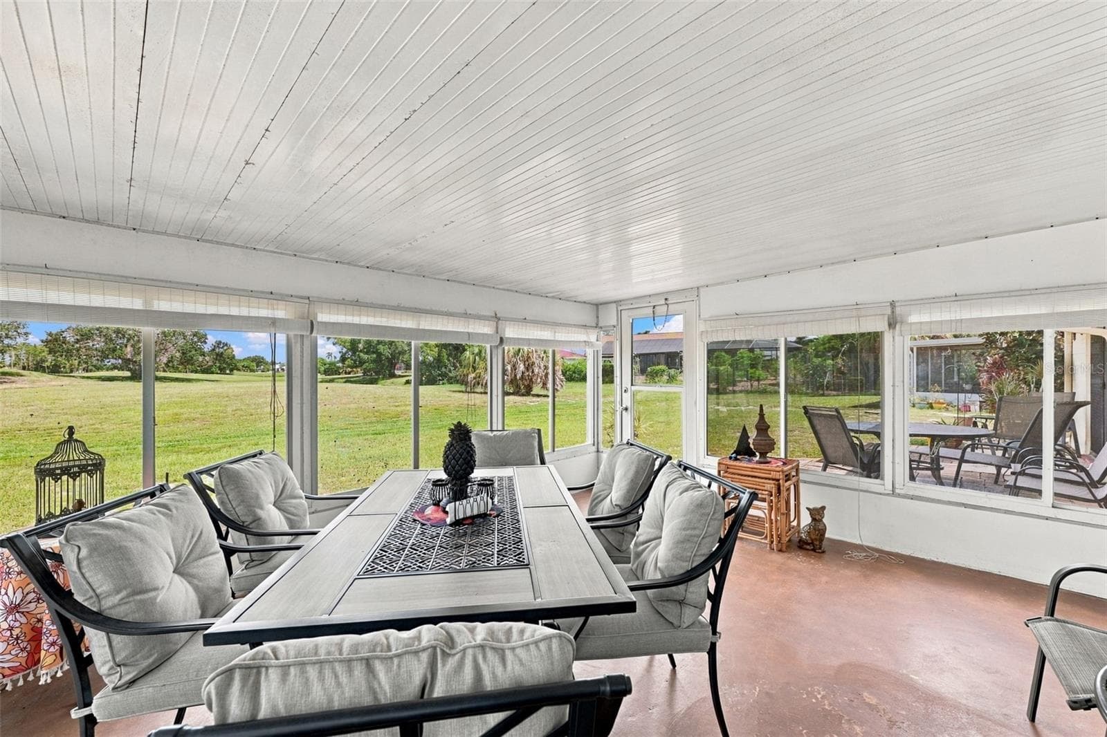 The Florida room has large windows so that you can enjoy this space year round.  What a view! - 215 GENET CT, SUN CITY CENTER