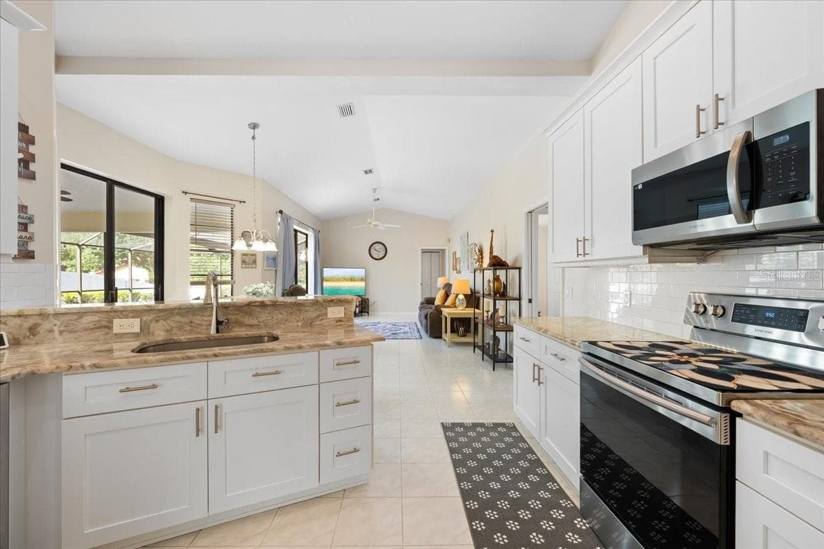 Kitchen looking out to Family Room - 2656 SADDLEWOOD LN, PALM HARBOR