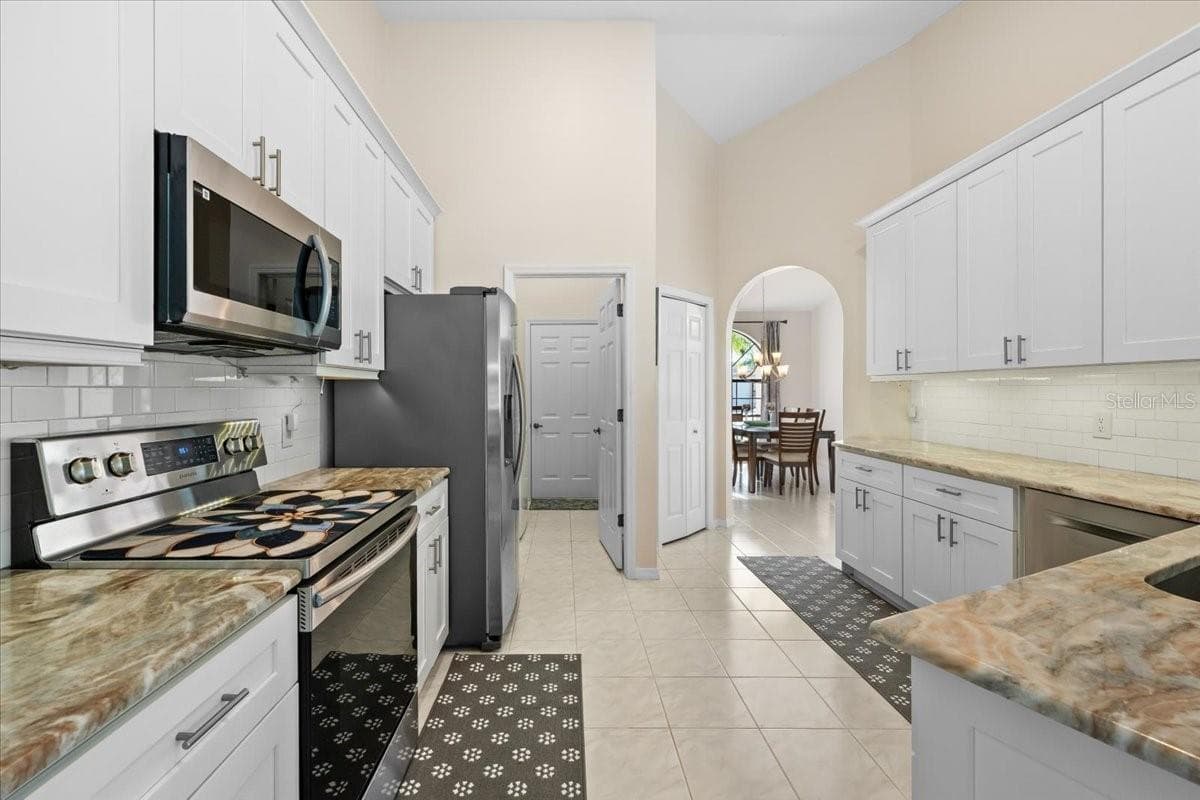 Kitchen looking out to Dining Room - 2656 SADDLEWOOD LN, PALM HARBOR