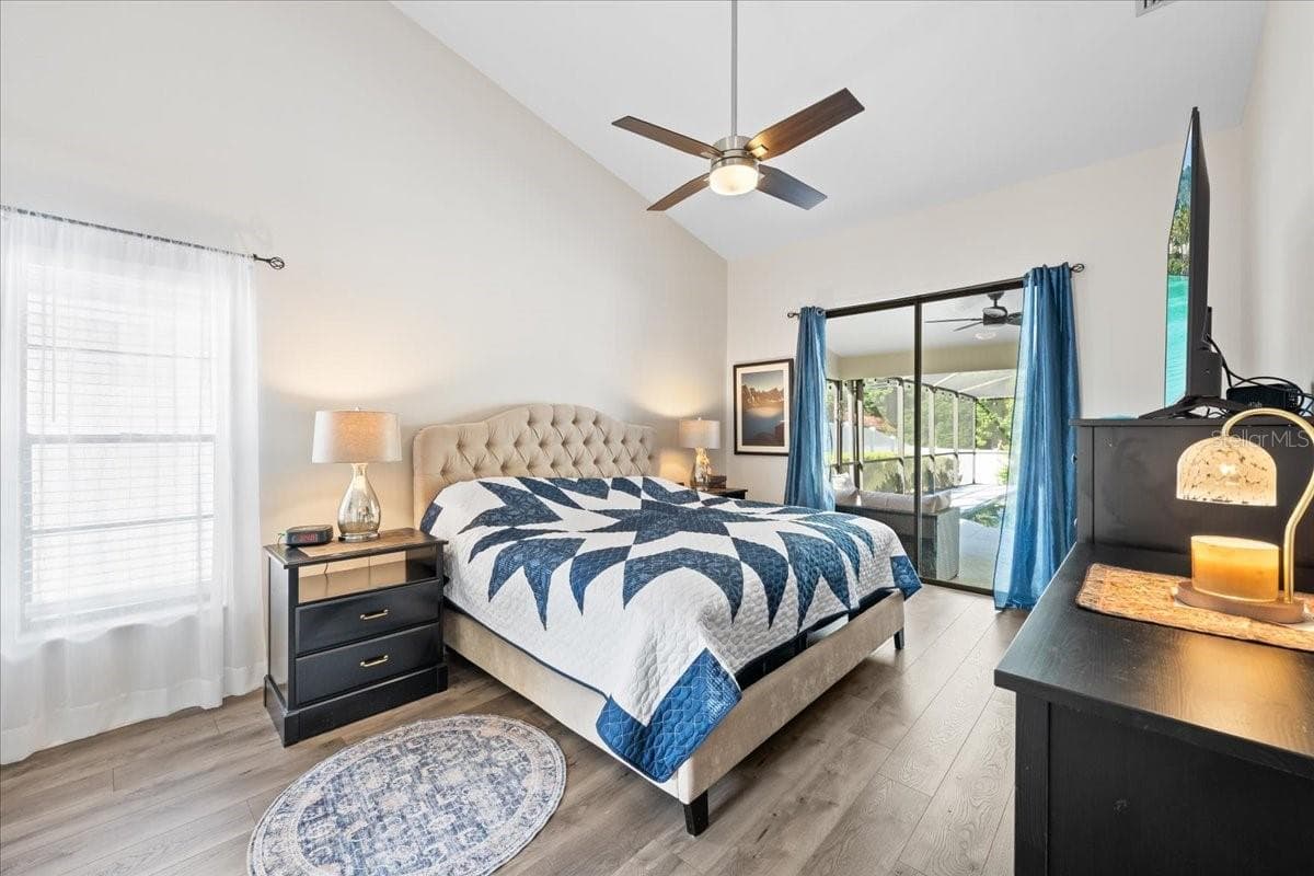 Primary Bedroom with Porch and Pool View - 2656 SADDLEWOOD LN, PALM HARBOR