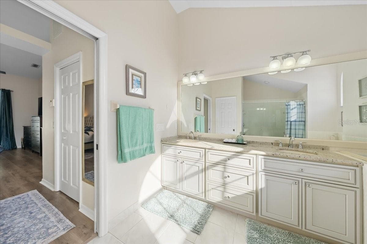 Primary Bath looking out to Primary Bedroom - 2656 SADDLEWOOD LN, PALM HARBOR