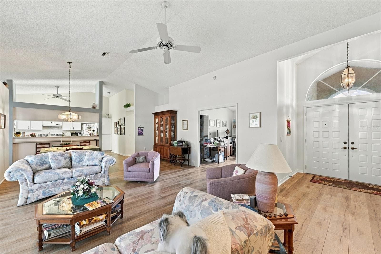 Living room area showing front door and third bedroom entrance - 8657 CYPRESS LAKES BLVD, NEW PORT RICHEY