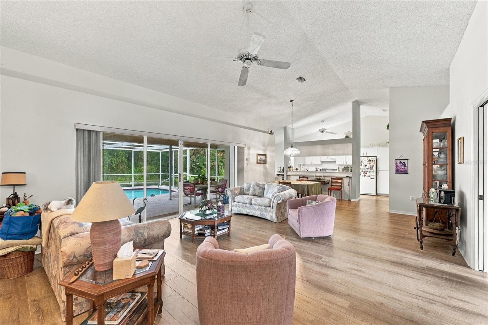 Open Living room area as seen from master  bedroom area - 8657 CYPRESS LAKES BLVD, NEW PORT RICHEY