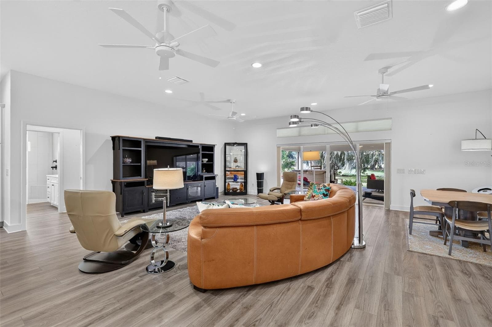 Living room with Telescoping Sliders to the outdoor oasis - 2741 DUNHAM DR, THE VILLAGES