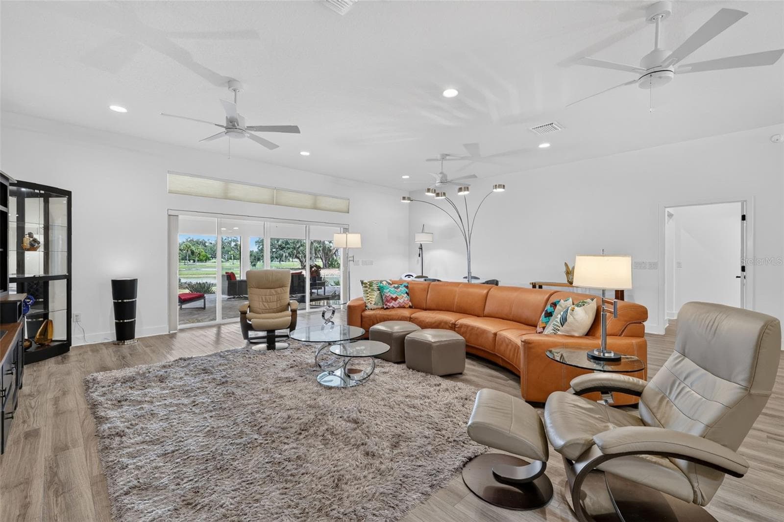 Living room with a view of the pond - 2741 DUNHAM DR, THE VILLAGES