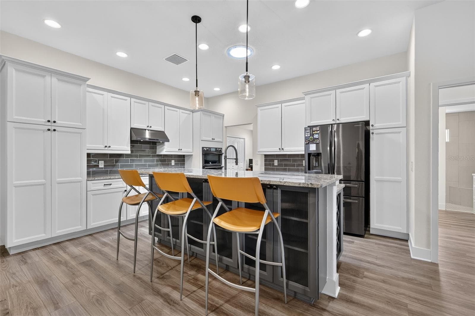 Kitchen with breakfast bar and storage - 2741 DUNHAM DR, THE VILLAGES
