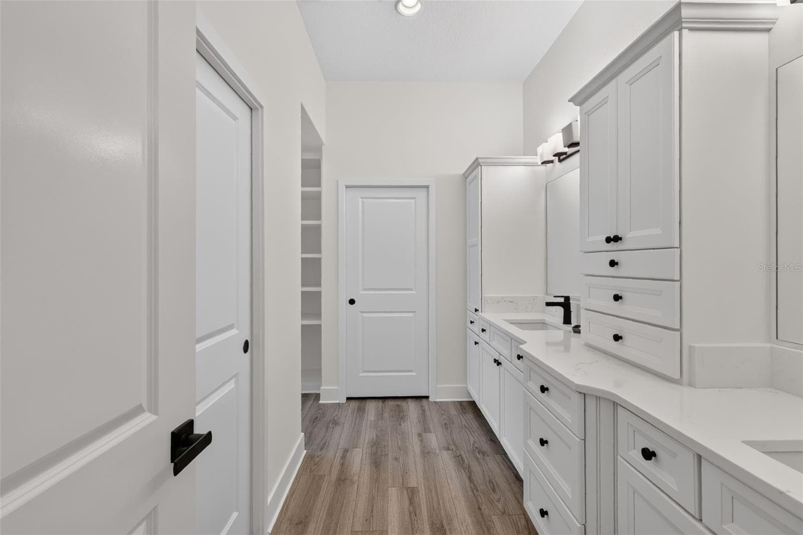 Primary en-suite bath with dual sinks and extra cabinets - 2741 DUNHAM DR, THE VILLAGES