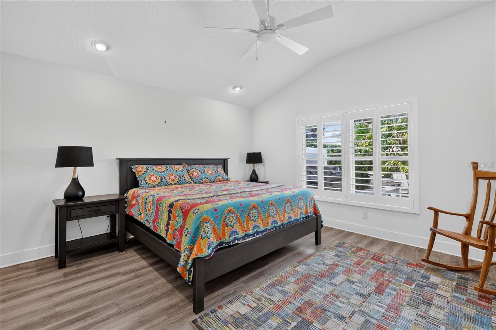 Back bedroom with high ceiling and view of the pond - 2741 DUNHAM DR, THE VILLAGES