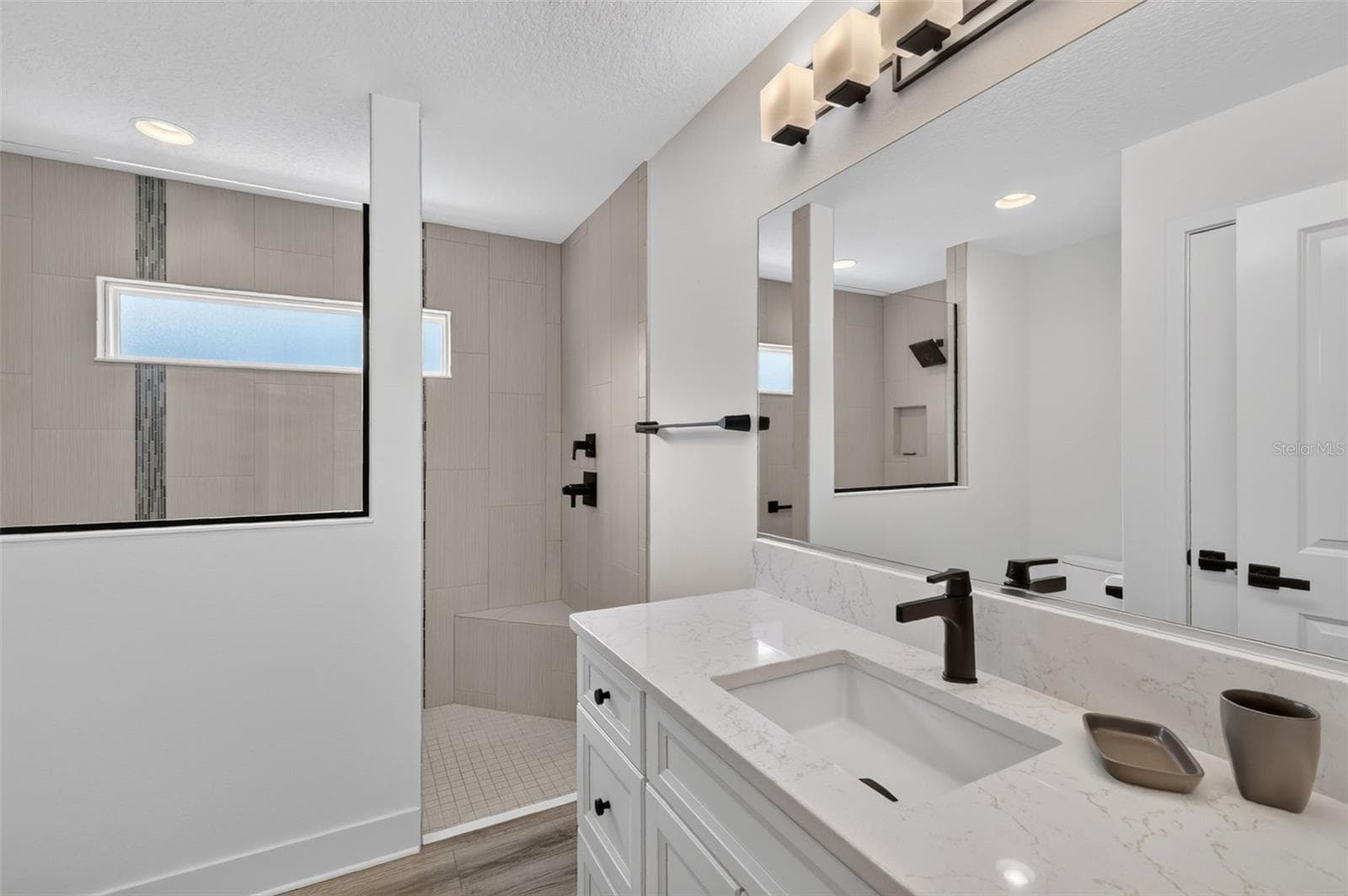 Back bathroom with walk-in tile shower - 2741 DUNHAM DR, THE VILLAGES