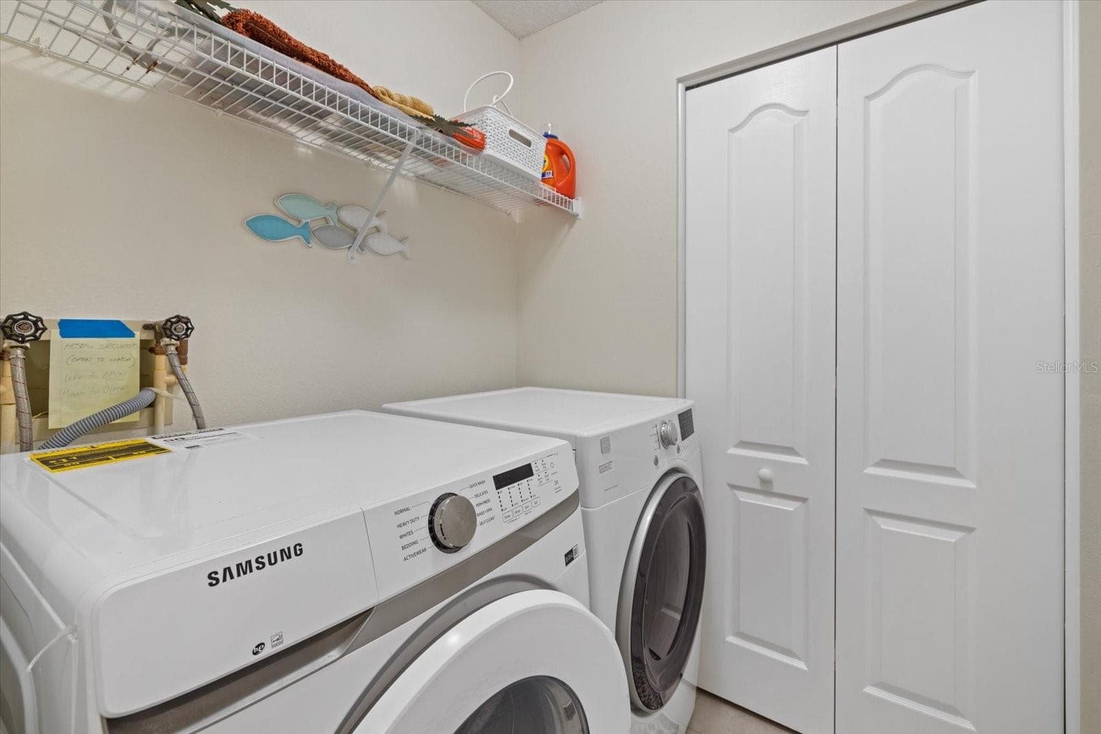 Laundry Room with storage Closet - 9580 HIGH GATE DR #1822, SARASOTA