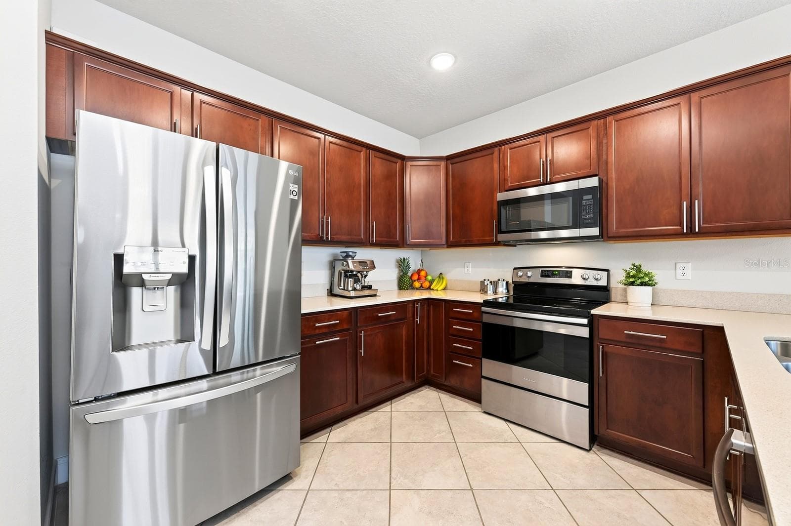 Stone counters and stainless steel appliances - 5264 SAPLING SPROUT DR, ORLANDO