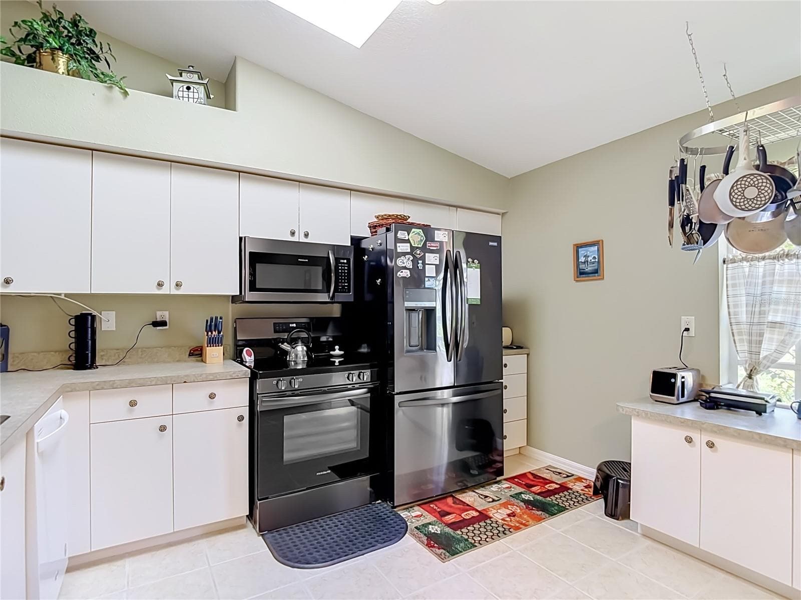 The kitchen has a lot of space for a large table if necessary. - 13424 NORMAN CIR, HUDSON